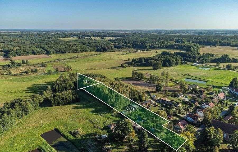 Urokliwe siedlisko 1,18 ha z domkami i stawem - idealne dla miłośników natury Opin  11 779m2 Foto 1