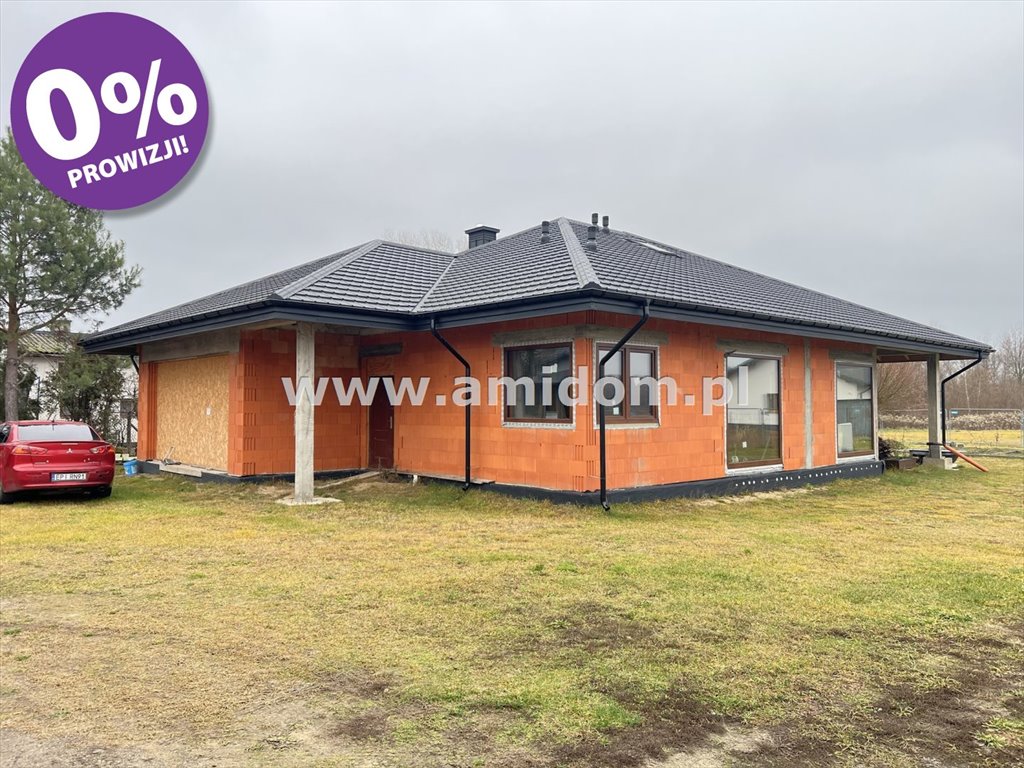 Nowoczesny dom parterowy z dużym garażem i funkcjonalnym układem Pasek  180m2 Foto 1