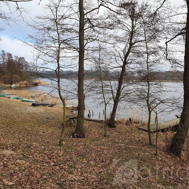 Działka nad jeziorem Woświn z dostępem do linii brzegowej Tucze  3 644m2 Foto 1
