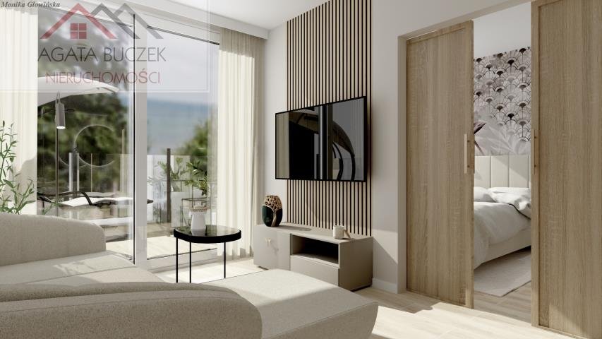 Na sprzedaż nowoczesny apartament z tarasem 12 m² w Rowach Rowy  48m2 Foto 1