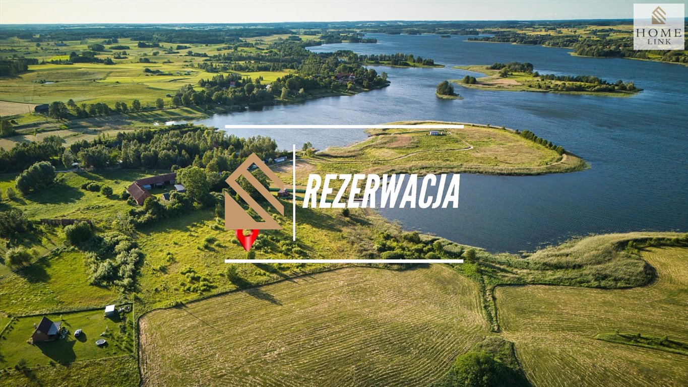 Działka nad jeziorem Szóstak z udziałem w plaży Orzechowo  3 884m2 Foto 1