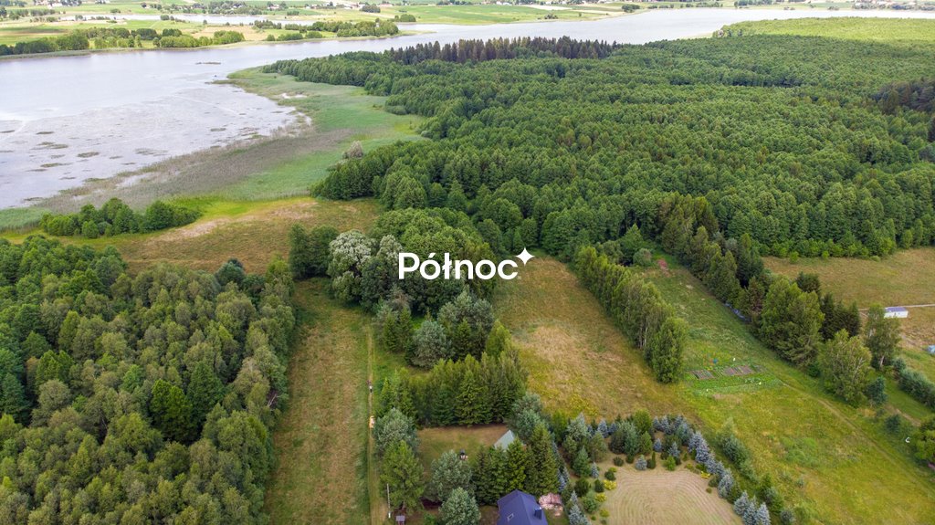 Do sprzedania działka nad jeziorem Tajno z lasem i warunkami zabudowy Orzechówka  2 096m2 Foto 1