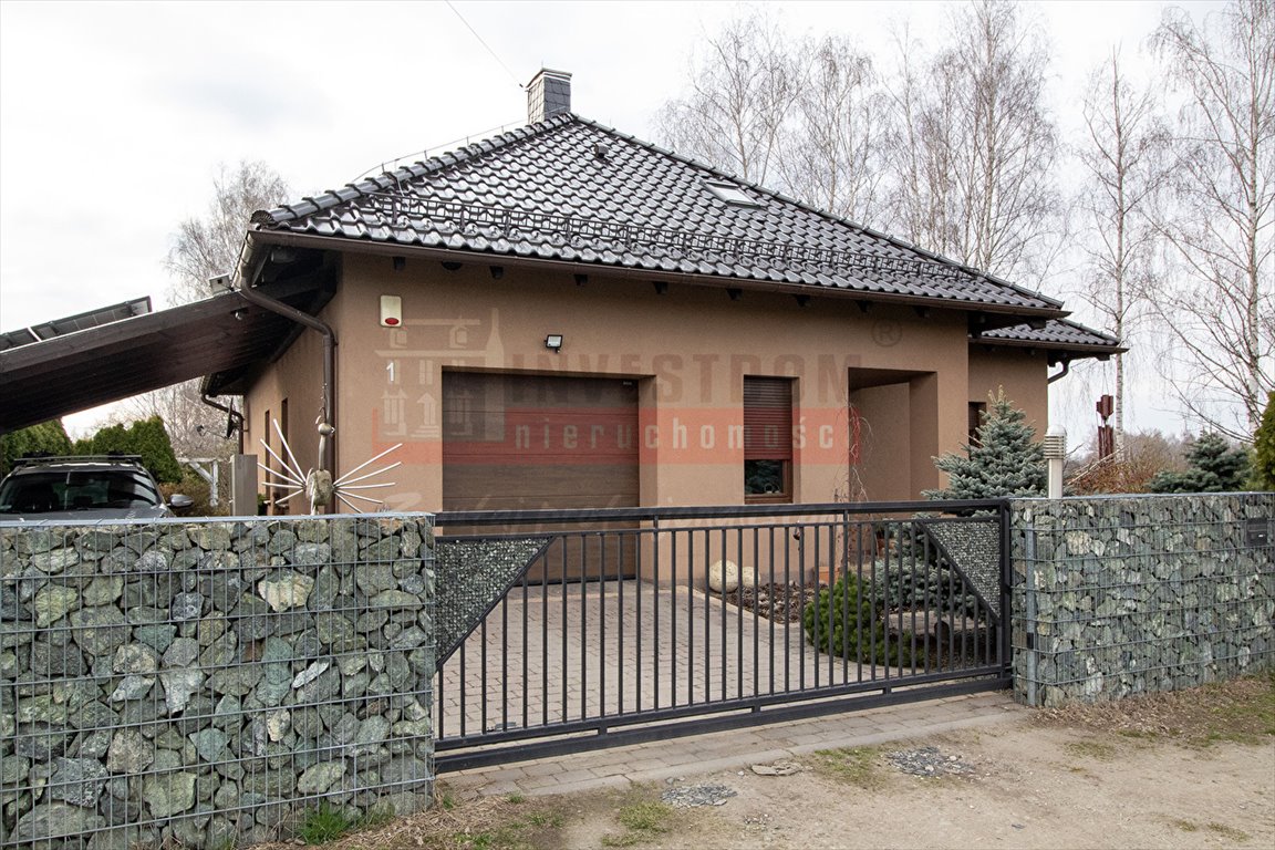 Zapraszam do obejrzenia przestronnego domu z garażem i pięknym ogrodem Ochodze  167m2 Foto 1