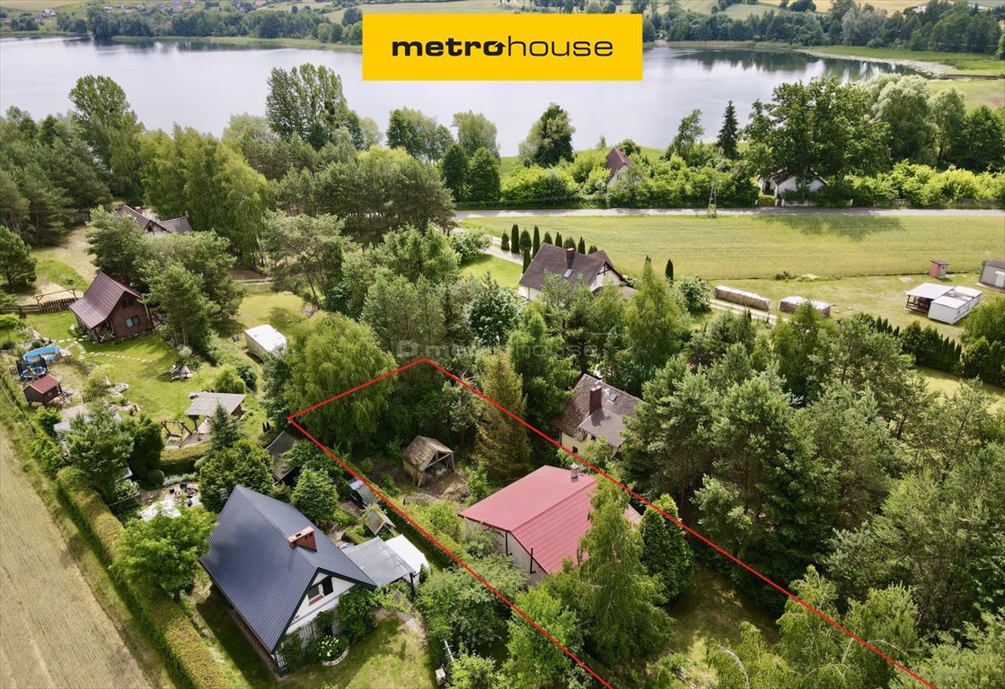 Urokliwy dom nad jeziorem z własnym pomostem i tarasem Skarlin  64m2 Foto 1