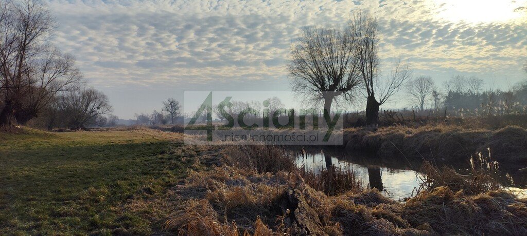 Zapraszam do zakupu działki z linią brzegową rzeki i warunkami zabudowy Cholewy  7 855m2 Foto 1