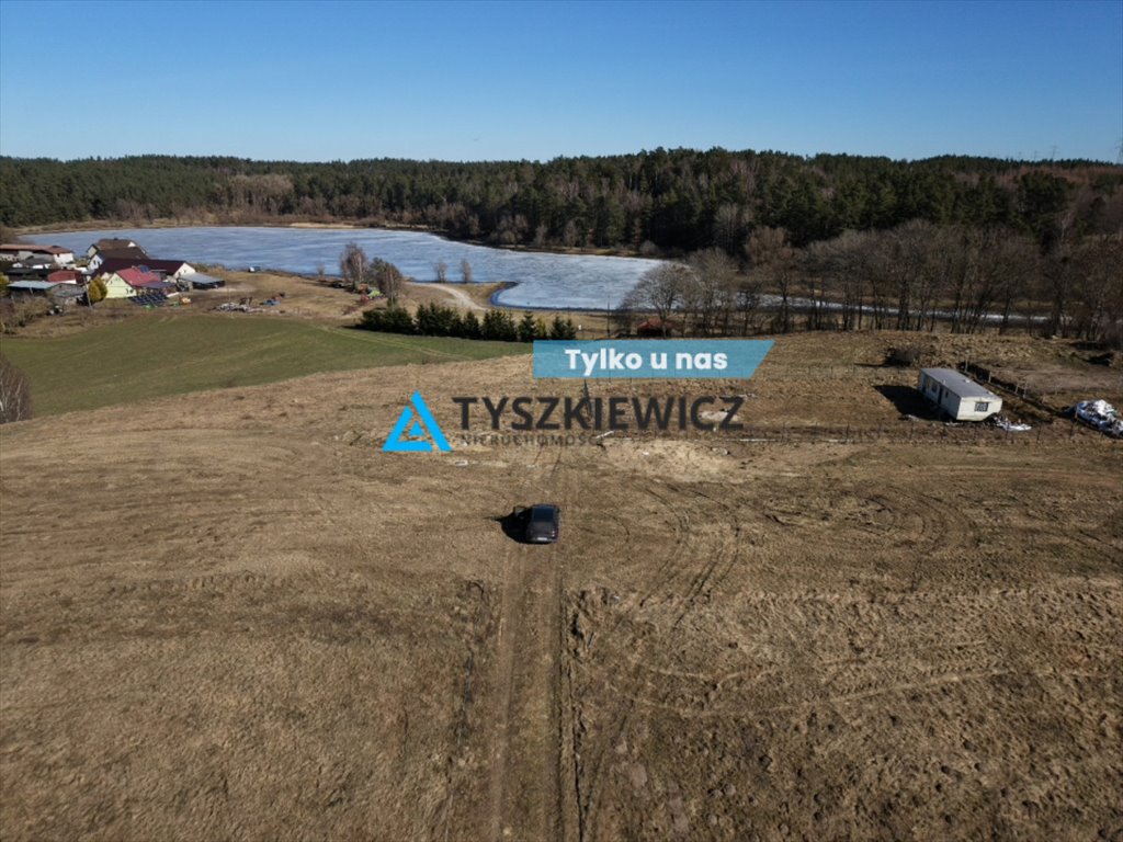 Działka z widokiem na jezioro w Okuninie – 1729 m² Okunino  1 729m2 Foto 1