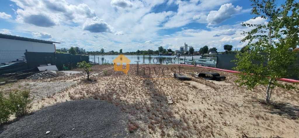 Do sprzedania działka nad jeziorem z nabrzeżem i mediami Spalona  1 172m2 Foto 1