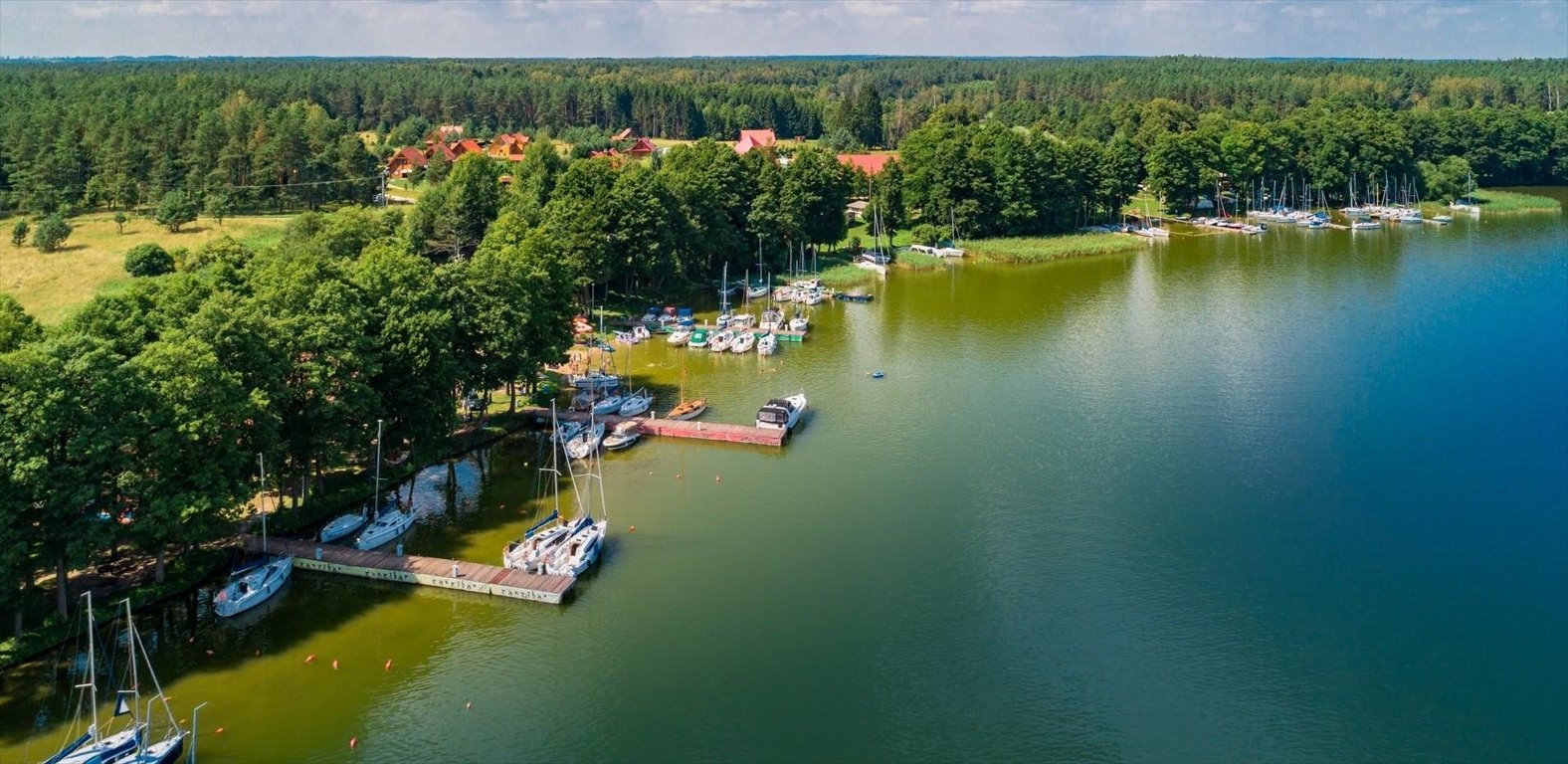 Do sprzedania działka z prywatną plażą i widokami na jeziora Mazurskie Rybical  1 438m2 Foto 1