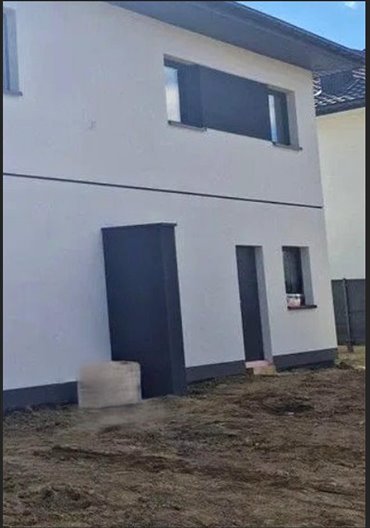 Nowoczesny dom bliźniak z ogródkiem i panelami fotowoltaicznymi dom Warszawa, Wawer, Las