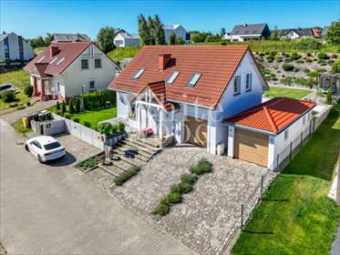 Urokliwy dom nad jeziorem Tuchomskim - ogród i garaże dom Warzno, Lipowa