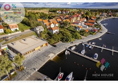 Dom nad jeziorem w Mikołajkach z pomostem i werandą dom Mikołajki, Michała Kajki