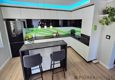 Dwupoziomowe 145 m² z ogrodem i kominkiem mieszkanie Marki, Bagienna