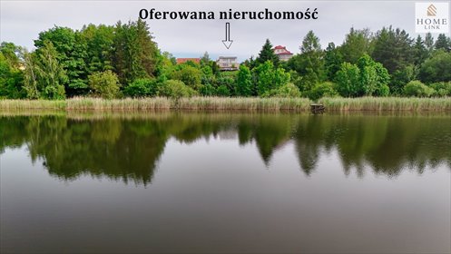 Działka z widokiem na Jezioro Dywickie i wolnostojącym budynkiem działka Dywity