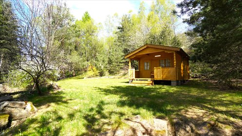 Do sprzedania urokliwy drewniany domek 20 m² z tarasem i dostępem do rzeki dom Kunkowa