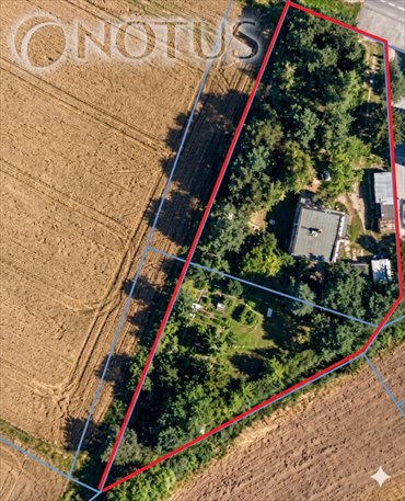 Przestronna działka 2427 m² z domem, garażami i ogrodem działka Paczynka
